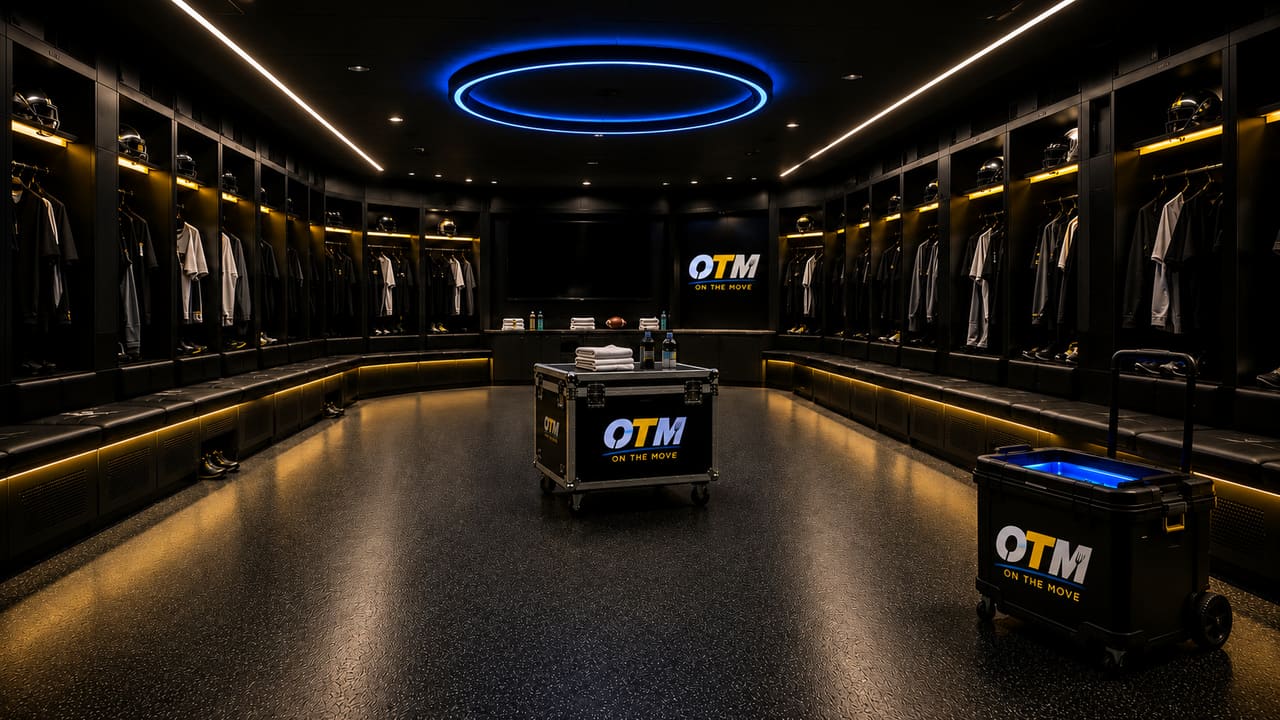 OTM cases staged in the center of a dark locker room before the team arrives